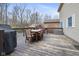 Outdoor dining on a weathered deck, complete with a grill and view of the backyard at 34 Gettysburg, Coatesville, IN 46121