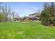 Large backyard with an in-ground pool, deck, patio, and a pool house at 34 Gettysburg, Coatesville, IN 46121