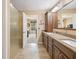 Serene bathroom featuring dual sinks, granite countertop, and walk-in shower at 34 Gettysburg, Coatesville, IN 46121
