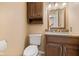 Powder room featuring granite countertop, dark wood vanity, and tiled floors at 34 Gettysburg, Coatesville, IN 46121