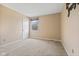 Neutral bedroom features beige carpeting, white trim and door, and natural light from the window at 34 Gettysburg, Coatesville, IN 46121