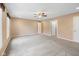 Large bedroom with neutral walls, carpet, and multiple windows, providing abundant natural light at 34 Gettysburg, Coatesville, IN 46121