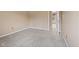 This neutral carpeted bedroom provides ample space for customization, with easy access to other rooms at 34 Gettysburg, Coatesville, IN 46121