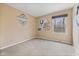 Bedroom with neutral carpeting and a window looking out to a treed area at 34 Gettysburg, Coatesville, IN 46121