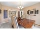Warm dining room with a chandelier, decor, and an open view to the living room at 34 Gettysburg, Coatesville, IN 46121