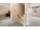 Hallway leading to a bedroom features neutral carpet and paint at 34 Gettysburg, Coatesville, IN 46121