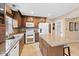 Charming kitchen featuring granite counters, stainless appliances, a center island, and custom cabinetry at 34 Gettysburg, Coatesville, IN 46121