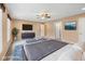 Contemporary main bedroom featuring stylish furniture, a ceiling fan, and a mounted television at 34 Gettysburg, Coatesville, IN 46121