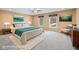 Stylishly staged main bedroom with plush bedding, modern decor, and large windows for ample natural light at 34 Gettysburg, Coatesville, IN 46121