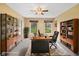 Well-lit home office featuring built-in shelving, dual-person desk, and large windows at 34 Gettysburg, Coatesville, IN 46121