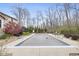 Large, covered in-ground pool with a deck in a treed area at 34 Gettysburg, Coatesville, IN 46121