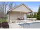 Pool house with an outdoor dining area and a fan at 34 Gettysburg, Coatesville, IN 46121