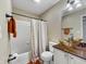 Bathroom featuring tub, shower, and vanity with copper-toned sink at 3708 Magenta Ln # 3, Indianapolis, IN 46214