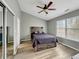 Bright bedroom with a large window, wood-style flooring, and neutral-toned walls at 3708 Magenta Ln # 3, Indianapolis, IN 46214
