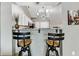 Kitchen bar with stylish wooden stools and pendant lighting that enhance overall appeal at 3708 Magenta Ln # 3, Indianapolis, IN 46214
