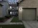 Charming two-story townhouse with a brick-lined garage and well-manicured lawn at 3708 Magenta Ln # 3, Indianapolis, IN 46214