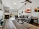 Cozy living room featuring a fireplace, plush seating, and access to outdoor deck at 3708 Magenta Ln # 3, Indianapolis, IN 46214