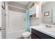 Bathroom featuring a shower and tub, vanity and mirror, with storage space and modern fixtures at 389 Longleaf Ln, Greenfield, IN 46140