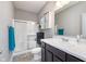 Bathroom featuring modern vanity, mirror, enclosed shower and tiled floors at 389 Longleaf Ln, Greenfield, IN 46140