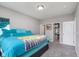 Comfortable bedroom with soft carpet, a bright window, and a walk-in closet at 389 Longleaf Ln, Greenfield, IN 46140