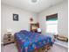 Cozy bedroom featuring a vibrant bed, a study desk, and natural light at 389 Longleaf Ln, Greenfield, IN 46140