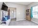 Comfortable room with a view, bench seating, and a bookshelf for storage and display at 389 Longleaf Ln, Greenfield, IN 46140