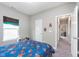 Comfortable bedroom featuring a bright window and easy access to other rooms at 389 Longleaf Ln, Greenfield, IN 46140