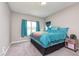 Cozy bedroom with carpeted floors, a comfortable bed, and a bright window with curtains at 389 Longleaf Ln, Greenfield, IN 46140