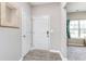 Inviting entryway featuring wood-look floors and a modern front door at 389 Longleaf Ln, Greenfield, IN 46140