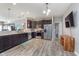 Open kitchen featuring dark cabinets, stainless steel appliances, and a spacious countertop at 389 Longleaf Ln, Greenfield, IN 46140