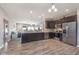 Modern kitchen featuring stainless steel appliances, dark cabinets, and an open layout at 389 Longleaf Ln, Greenfield, IN 46140