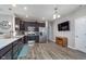 Well-lit kitchen with stainless steel appliances, dark cabinetry, and an open design at 389 Longleaf Ln, Greenfield, IN 46140