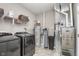 Utility room with washer, dryer, water heater, filtration system, and a modern HVAC system at 389 Longleaf Ln, Greenfield, IN 46140