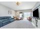 Cozy living room with carpet and a sliding door to the outside at 389 Longleaf Ln, Greenfield, IN 46140