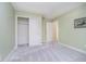 Clean and bright bedroom with neutral carpet, an open closet, and fresh paint at 4615 Crystal Lake Dr, Indianapolis, IN 46240