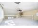 Bright bonus room boasts lots of light, a ceiling fan, and plenty of open space at 4615 Crystal Lake Dr, Indianapolis, IN 46240