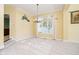 Bright dining room with a large window and elegant chandelier, great for entertaining at 4615 Crystal Lake Dr, Indianapolis, IN 46240