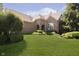 Beautiful brick home with lush landscaping and a well-maintained lawn at 4615 Crystal Lake Dr, Indianapolis, IN 46240