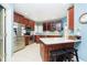 Modern kitchen with stainless steel appliances, wood cabinets, and ample counter space at 4615 Crystal Lake Dr, Indianapolis, IN 46240
