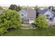 View of the home's exterior featuring a well manicured yard and patio area for outdoor enjoyment at 4615 Crystal Lake Dr, Indianapolis, IN 46240