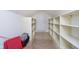 Ample storage in this walk-in storage room with built-in shelving and tile flooring at 4615 Crystal Lake Dr, Indianapolis, IN 46240