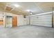 Spacious two-car garage with ample storage and a concrete floor, perfect for parking and projects at 4704 Blue Marlin Way, Indianapolis, IN 46239