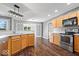 Modern kitchen with stainless steel appliances, wooden cabinetry, and an open layout at 4704 Blue Marlin Way, Indianapolis, IN 46239