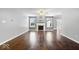 Bright living room featuring fireplace, hardwood floors, and natural light at 4704 Blue Marlin Way, Indianapolis, IN 46239