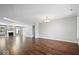 Bright, open-concept living room with hardwood floors and large windows for natural light at 4704 Blue Marlin Way, Indianapolis, IN 46239