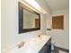 Bright bathroom with a double sink vanity, large mirror, and modern fixtures at 5034 Allisonville Rd # A, Indianapolis, IN 46205