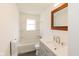 Well-lit bathroom featuring a vanity, sink, and a shower/tub combination at 5034 Allisonville Rd # A, Indianapolis, IN 46205