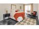 Inviting bedroom with a comfortable bed, stylish furnishings, and a cozy seating area near the bright window at 5034 Allisonville Rd # A, Indianapolis, IN 46205