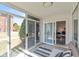Cozy sunroom featuring sliding glass doors, comfortable seating, and natural light streaming through at 5034 Allisonville Rd # A, Indianapolis, IN 46205