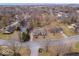 Aerial view of a residential neighborhood showcasing the property among mature trees and well-maintained homes at 5445 Elderberry Rd, Noblesville, IN 46062